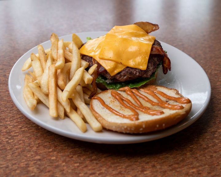 Dimond Burger with melted cheese and a side of fries