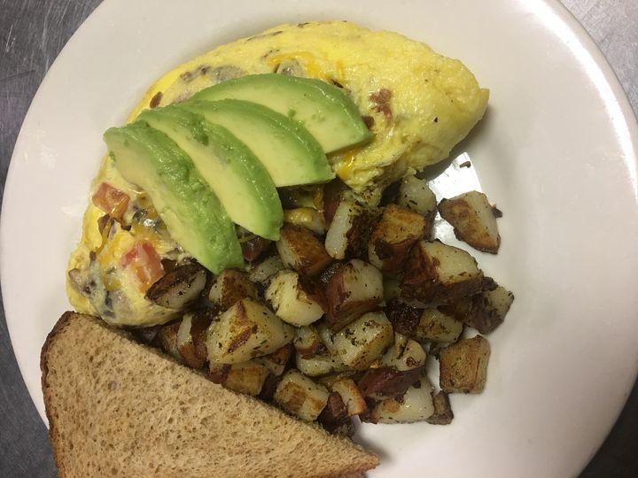 Omelet with avocado, potatoes and wheat toast